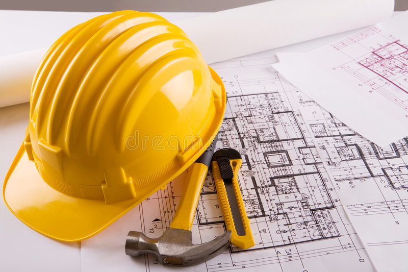 Construction Blueprint with Hardhat - MPS Construction and Design - Top Rated Commercial Construction Contractors in San Antonio